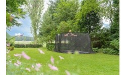 EXIT Dynamic ground level trampoline 305x519cm with safety net - black